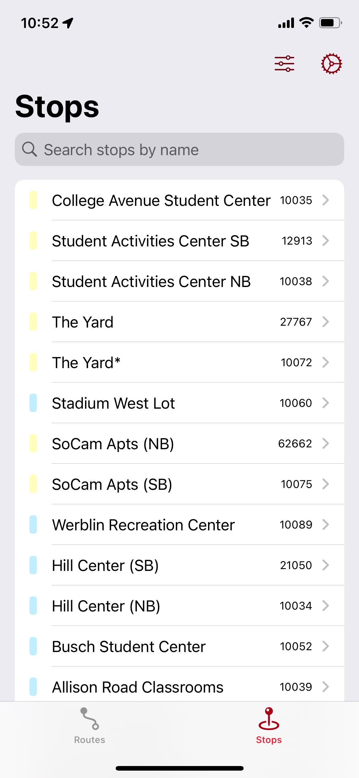 The “Stops” tab in an early version of RURadar, showing stops with their campus color, and a debug stop ID on the right.